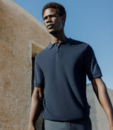 Navy button-down polo shirt in a polka dot pattern