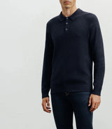 Navy polo-neck sweater with buttons and stitches