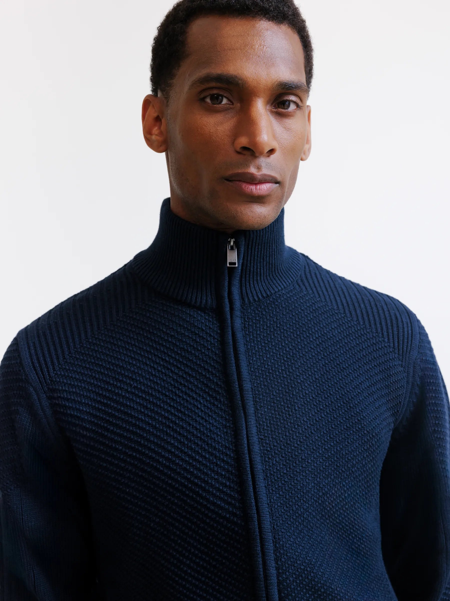 Navy zip-up cardigan with stitch detailing