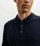 Navy polo-neck sweater with buttons and stitches