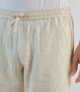 Beige Bermuda shorts with elasticated waist and drawstring