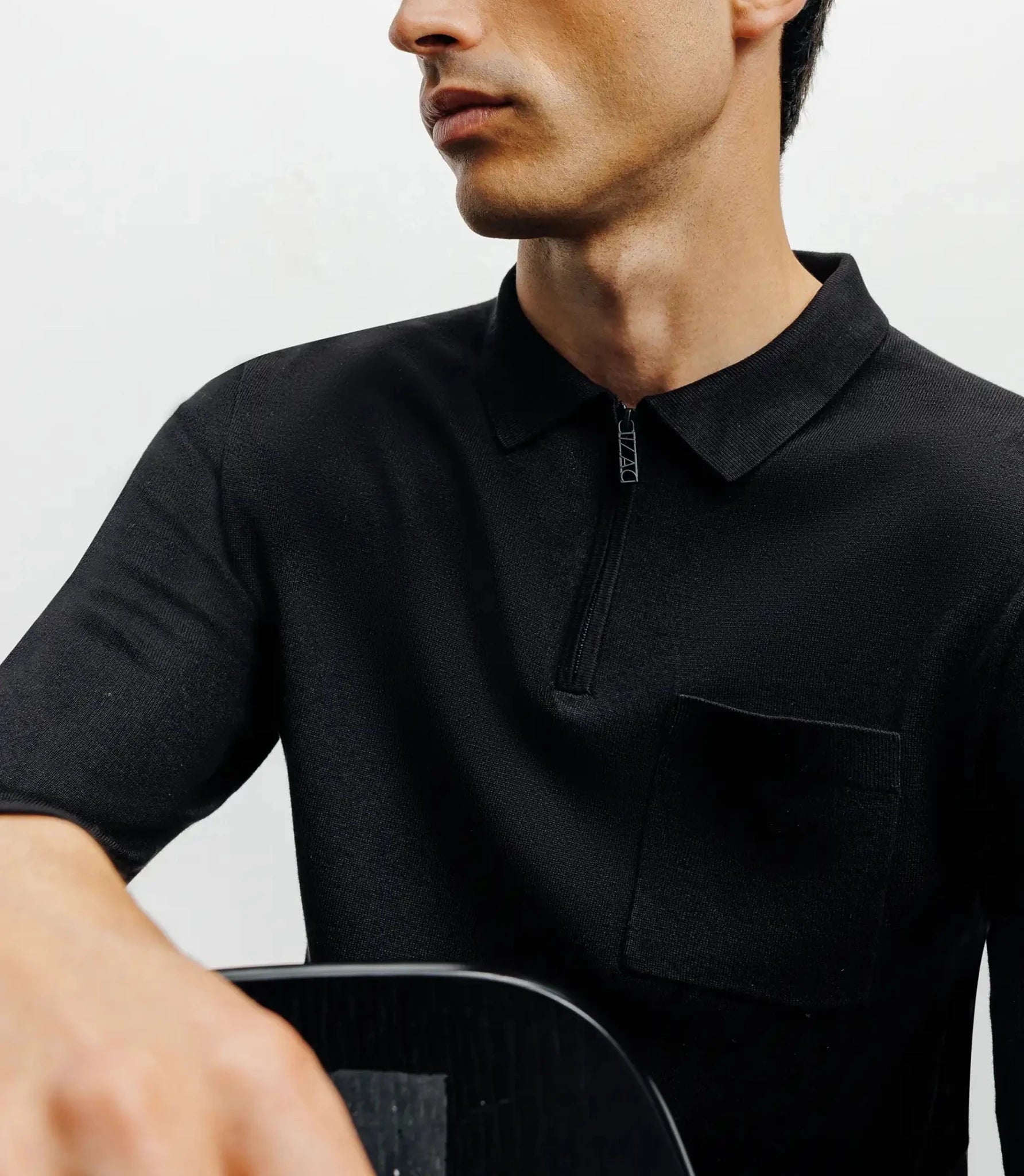 Zipped polo-neck sweater in black fine knit