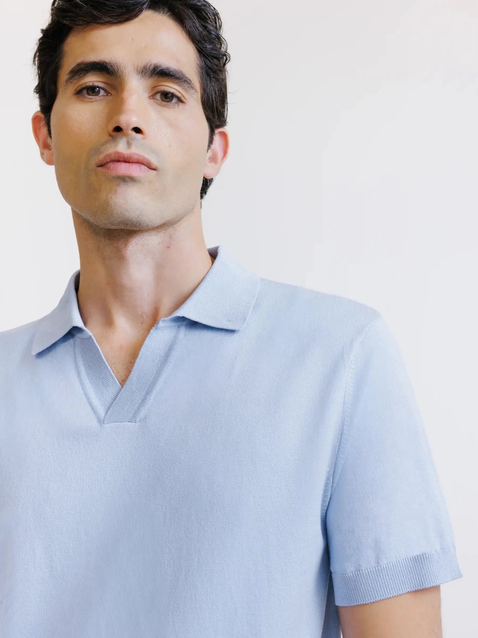 sky blue open-neck knit polo shirt