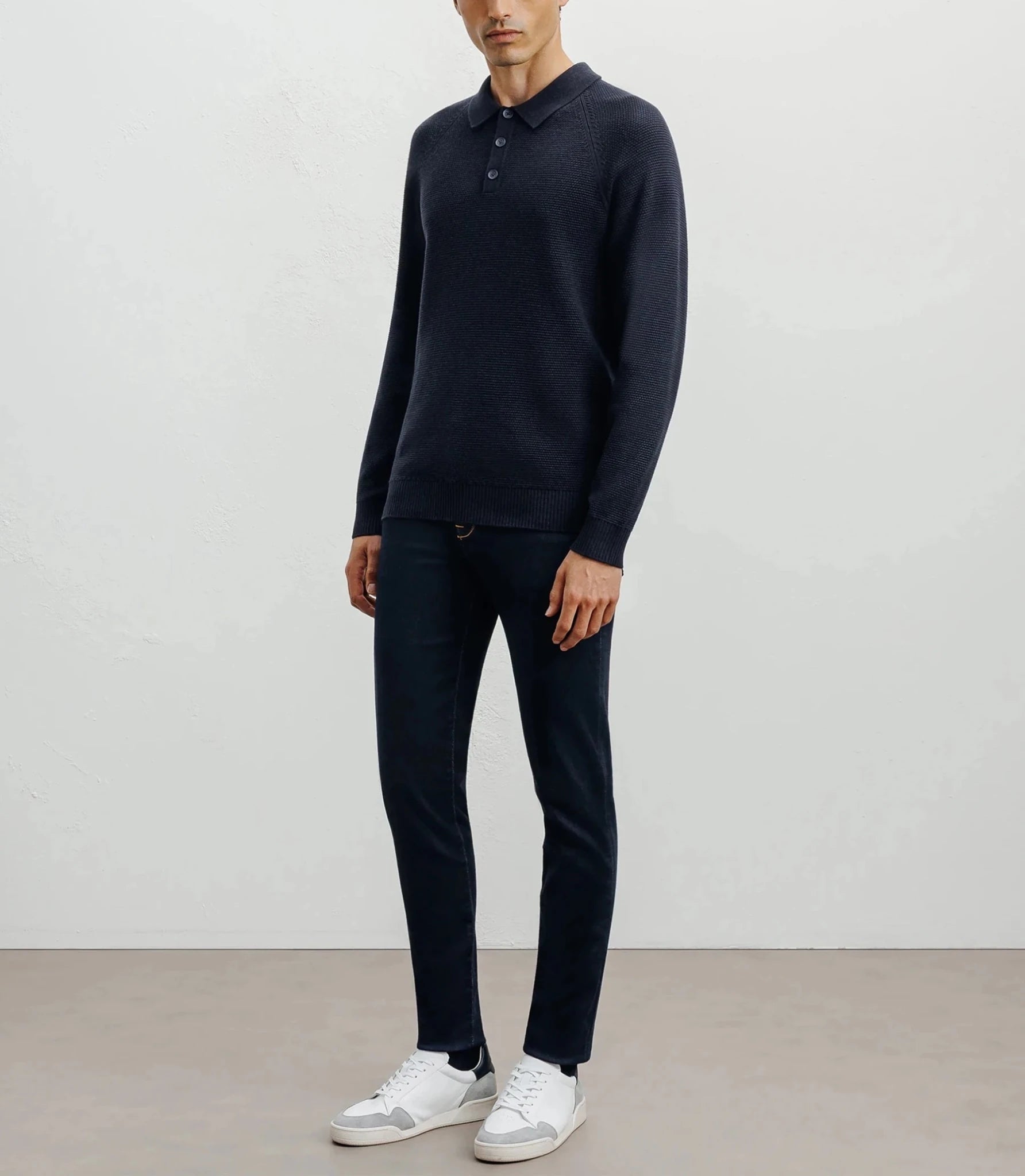 Navy polo-neck sweater with buttons and stitches