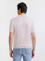 Light pink open-collar knit polo shirt