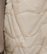 Beige double-breasted trench coat
