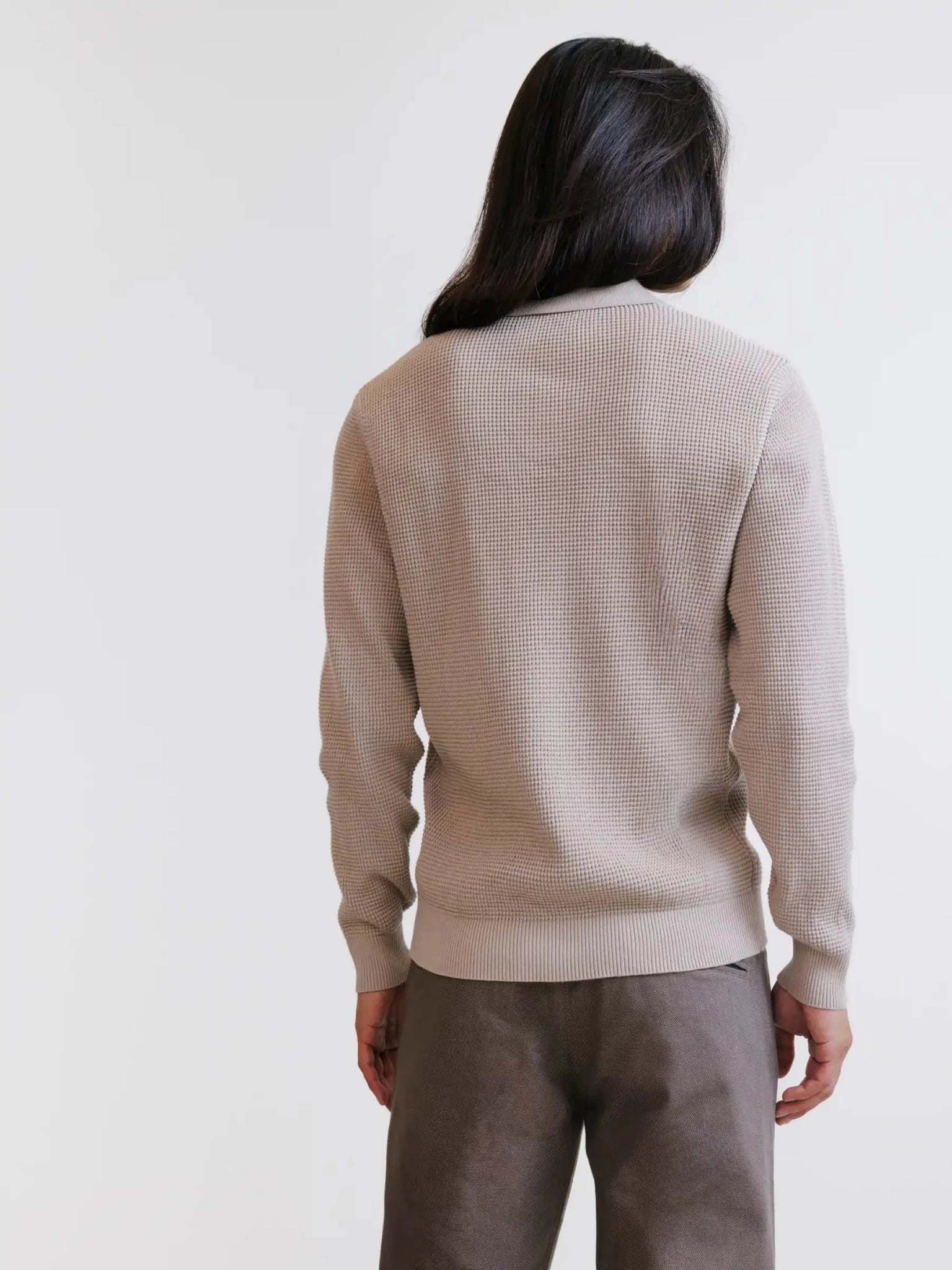Beige open polo collar jumper with textured stitching