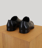 Black leather richelieu shoes
