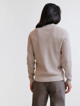 Beige open polo collar jumper with textured stitching