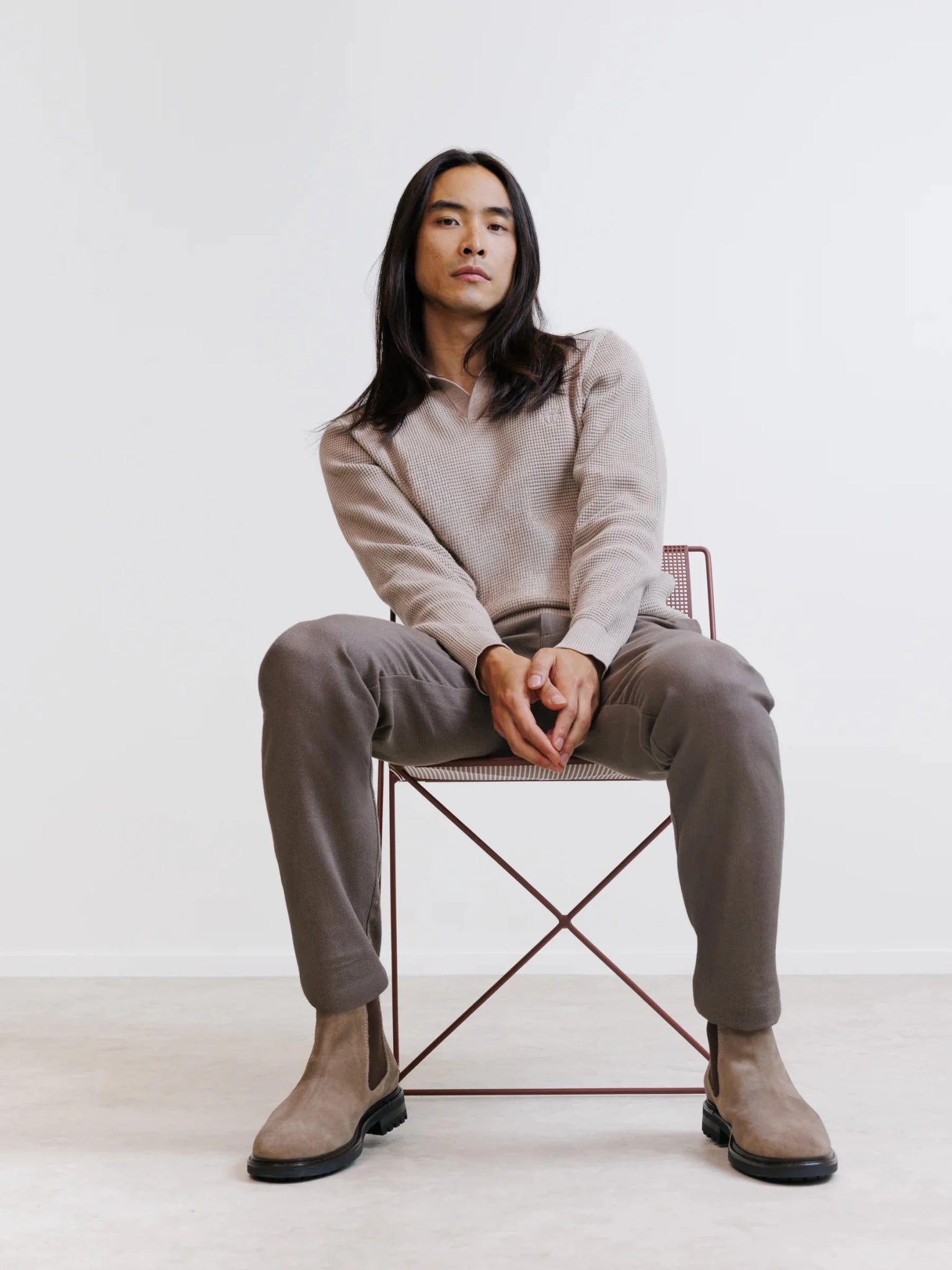 Beige open polo collar jumper with textured stitching