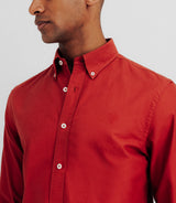 Shirt with orange buttoned collar