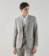 Two-button suit in taupe-colored wool.