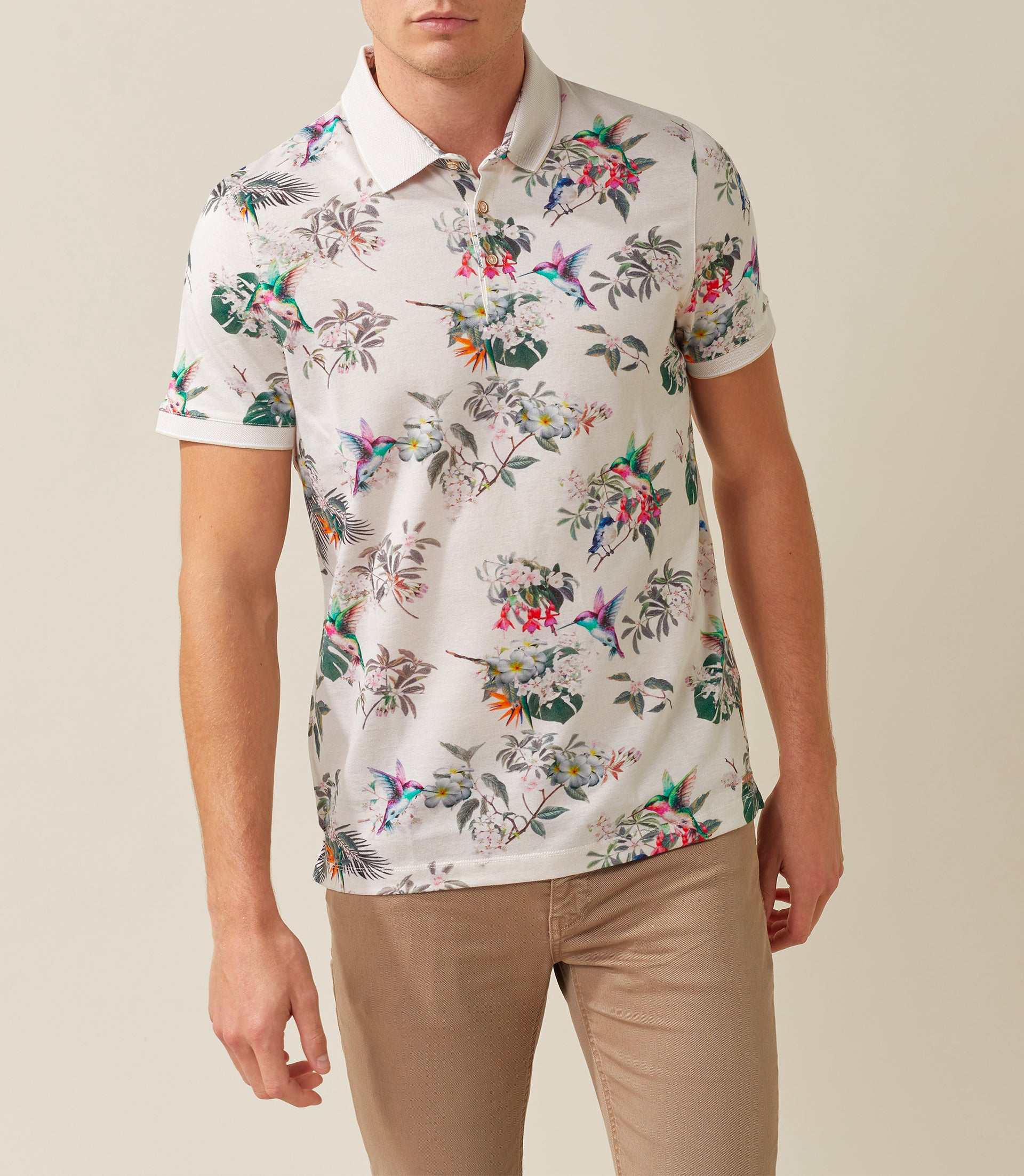 Rebel" beige polo shirt with tropical pattern