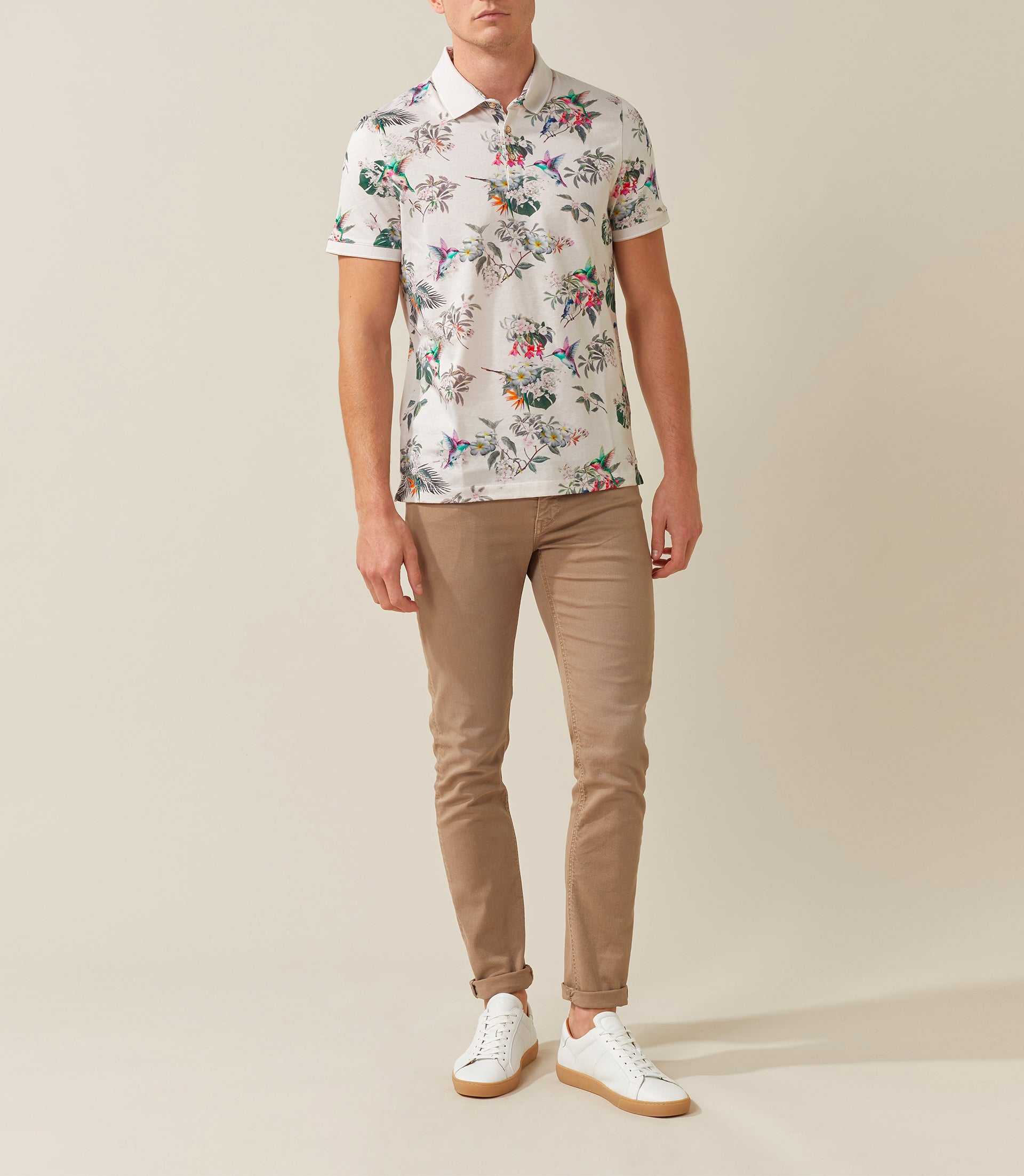 Rebel" beige polo shirt with tropical pattern